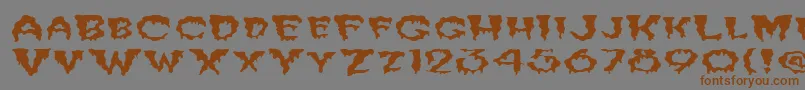 フォントFzUnique10WaveyEx – 茶色の文字が灰色の背景にあります。