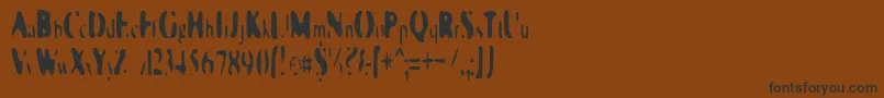 フォントGalaxiaSingularity – 黒い文字が茶色の背景にあります