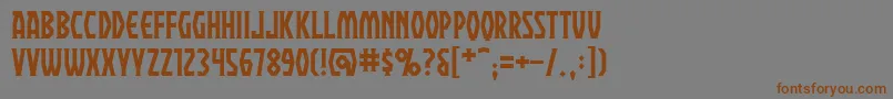 フォントPraetoriumBb – 茶色の文字が灰色の背景にあります。