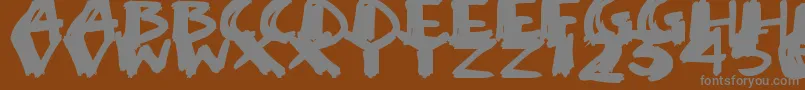 SuperSketch Font – Gray Fonts on Brown Background