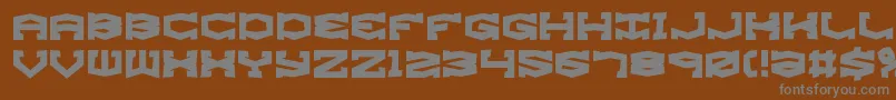 GyroseShiftBrk-fontti – harmaat kirjasimet ruskealla taustalla
