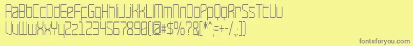 RavepartyNarrow-Schriftart – Graue Schriften auf gelbem Hintergrund