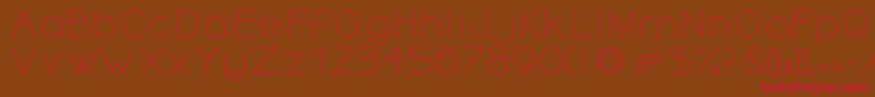 フォントOrmontOutline – 赤い文字が茶色の背景にあります。