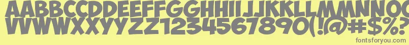 Czcionka ObelixProBold – szare czcionki na żółtym tle