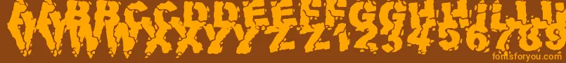 フォントVolcanicDungeon – オレンジ色の文字が茶色の背景にあります。