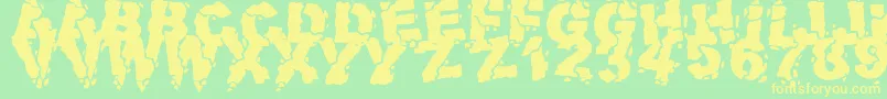 フォントVolcanicDungeon – 黄色の文字が緑の背景にあります
