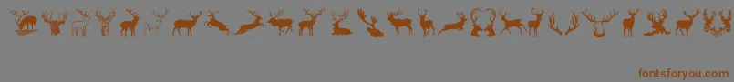 フォントDeers – 茶色の文字が灰色の背景にあります。