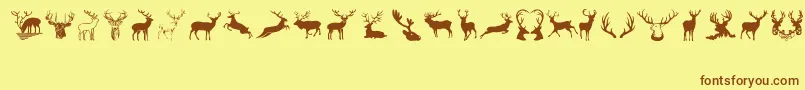 フォントDeers – 茶色の文字が黄色の背景にあります。