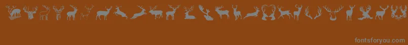 Deers-Schriftart – Graue Schriften auf braunem Hintergrund