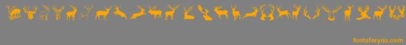 フォントDeers – オレンジの文字は灰色の背景にあります。