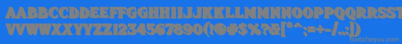 Fhadevshnc-Schriftart – Graue Schriften auf blauem Hintergrund