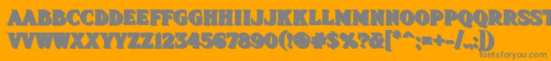 Fhadevshnc-Schriftart – Graue Schriften auf orangefarbenem Hintergrund
