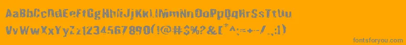 Quarrystoneexpand-Schriftart – Graue Schriften auf orangefarbenem Hintergrund