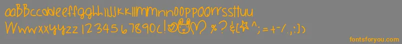 フォントOrangecounty – オレンジの文字は灰色の背景にあります。