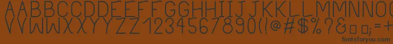 PhilippineRegular Font – Black Fonts on Brown Background