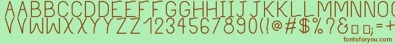 フォントPhilippineRegular – 緑の背景に茶色のフォント