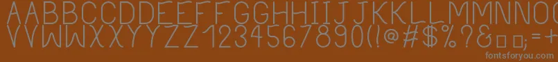 フォントPhilippineRegular – 茶色の背景に灰色の文字
