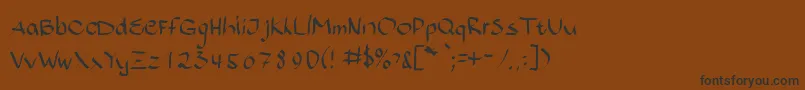 フォントBajsporr – 黒い文字が茶色の背景にあります