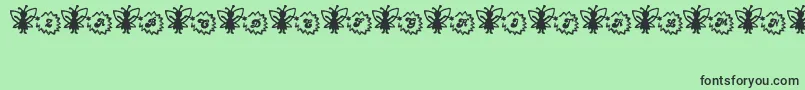 Czcionka FairySparkle – czarne czcionki na zielonym tle