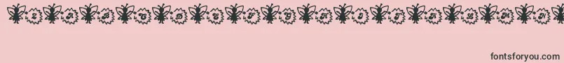 フォントFairySparkle – ピンクの背景に黒い文字