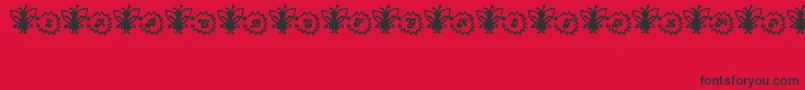 Czcionka FairySparkle – czarne czcionki na czerwonym tle