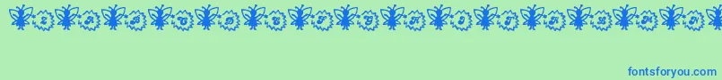 Fonte FairySparkle – fontes azuis em um fundo verde