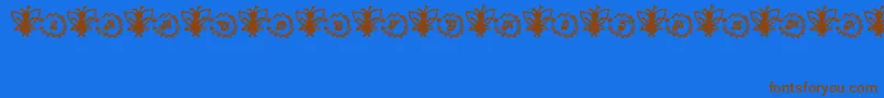 Czcionka FairySparkle – brązowe czcionki na niebieskim tle