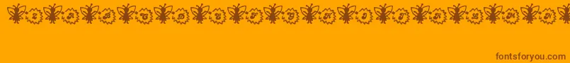 FairySparkle-Schriftart – Braune Schriften auf orangefarbenem Hintergrund