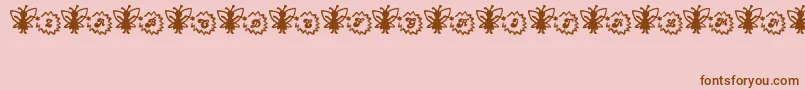 FairySparkle-Schriftart – Braune Schriften auf rosa Hintergrund