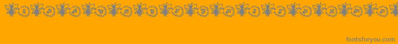 FairySparkle-Schriftart – Graue Schriften auf orangefarbenem Hintergrund
