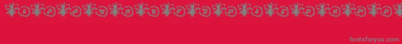 Czcionka FairySparkle – szare czcionki na czerwonym tle