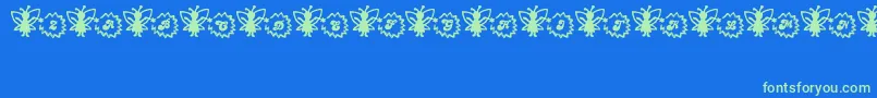 Czcionka FairySparkle – zielone czcionki na niebieskim tle