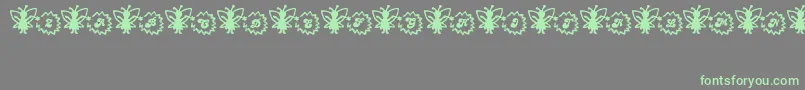 Czcionka FairySparkle – zielone czcionki na szarym tle