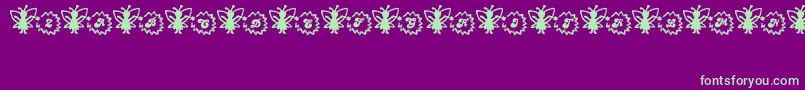 FairySparkle-Schriftart – Grüne Schriften auf violettem Hintergrund