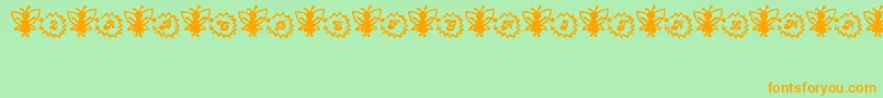 Czcionka FairySparkle – pomarańczowe czcionki na zielonym tle