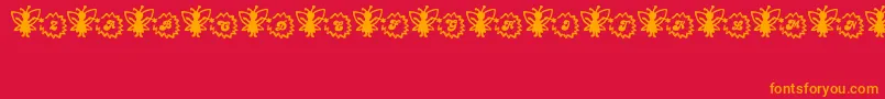 Czcionka FairySparkle – pomarańczowe czcionki na czerwonym tle