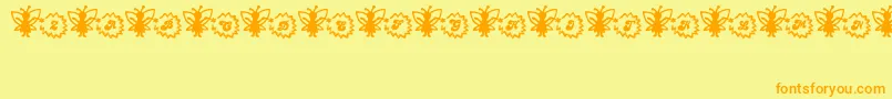 Czcionka FairySparkle – pomarańczowe czcionki na żółtym tle