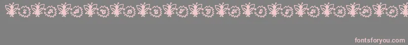 フォントFairySparkle – 灰色の背景にピンクのフォント
