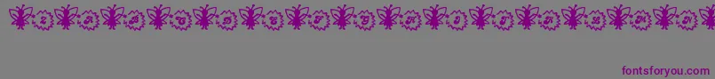 フォントFairySparkle – 紫色のフォント、灰色の背景