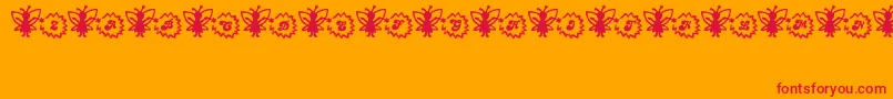 Czcionka FairySparkle – czerwone czcionki na pomarańczowym tle