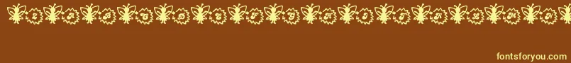 Czcionka FairySparkle – żółte czcionki na brązowym tle