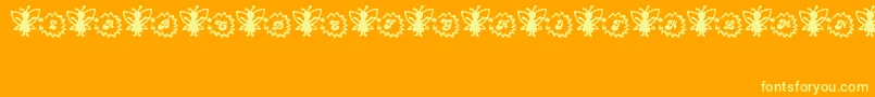 Fonte FairySparkle – fontes amarelas em um fundo laranja