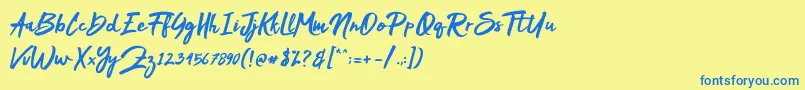 フォントMakDah – 青い文字が黄色の背景にあります。