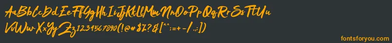 フォントMakDah – 黒い背景にオレンジの文字