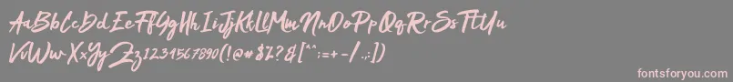 フォントMakDah – 灰色の背景にピンクのフォント