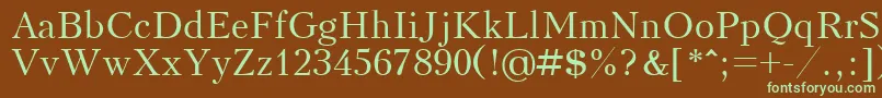 フォントKudrashovctt – 緑色の文字が茶色の背景にあります。
