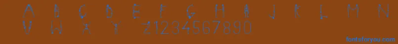 Czcionka Skeletonalphabet – niebieskie czcionki na brązowym tle