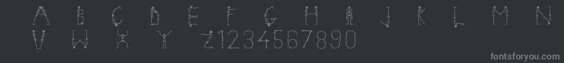 Skeletonalphabet-fontti – harmaat kirjasimet mustalla taustalla