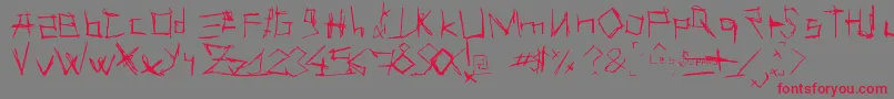 フォントLesSuppos – 赤い文字の灰色の背景