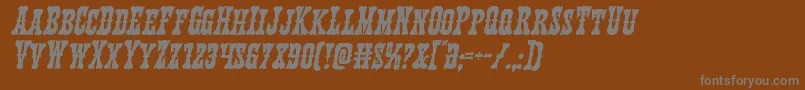 Texasrangerital-fontti – harmaat kirjasimet ruskealla taustalla